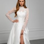 The Catherine  wedding dress is a tribute to refined royal elegance, inspired by the iconic bridal style of Kate Middleton, who brought lace sleeves back into modern wedding fashion and redefined timeless bridal sophistication. Designed for brides who appreciate grace, femininity, and classic beauty, this gown embodies aristocratic charm with a contemporary touch.