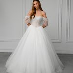 Bianca is designed for the bride who values clean lines, structure, and the philosophy that less is more. Its precise architectural cut enhances the figure, creating a striking silhouette without excessive embellishment. Every detail is carefully considered to deliver a confident, sophisticated bridal look.