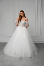 Bianca is designed for the bride who values clean lines, structure, and the philosophy that less is more. Its precise architectural cut enhances the figure, creating a striking silhouette without excessive embellishment. Every detail is carefully considered to deliver a confident, sophisticated bridal look.